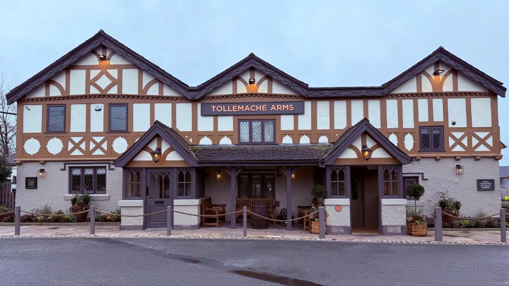 a building with a sign that reads boilermaker amps at Tollemache Arms in Calveley
