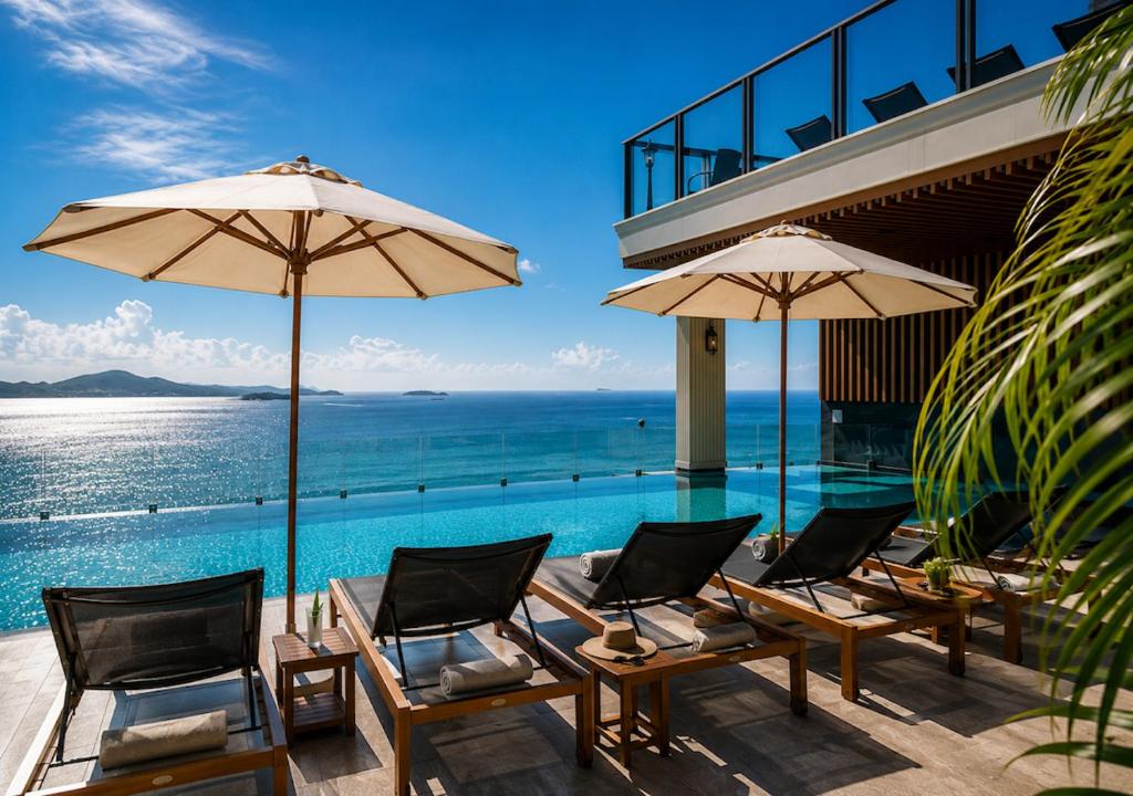 a group of chairs and umbrellas next to a swimming pool at The Elysium Prațumnak Pattaya - By SHG in Pattaya South