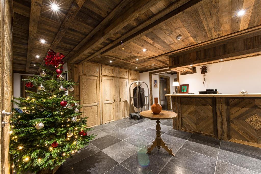 a christmas tree in the kitchen of a house at Le Chalet Blanc in Megève