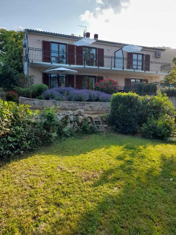 a house with a lawn in front of it at Villa Marija in Opatija