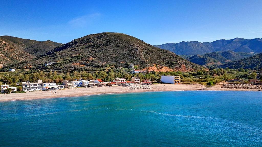an aerial view of a beach with a mountain at Fodele Beachfront Apts in Fodele