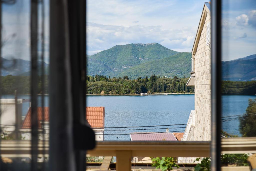 a view of a lake from a window at Maslina Krtoli in Tivat