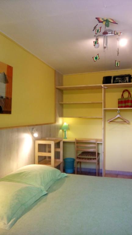 Postel nebo postele na pokoji v ubytování Relais du Volcan
