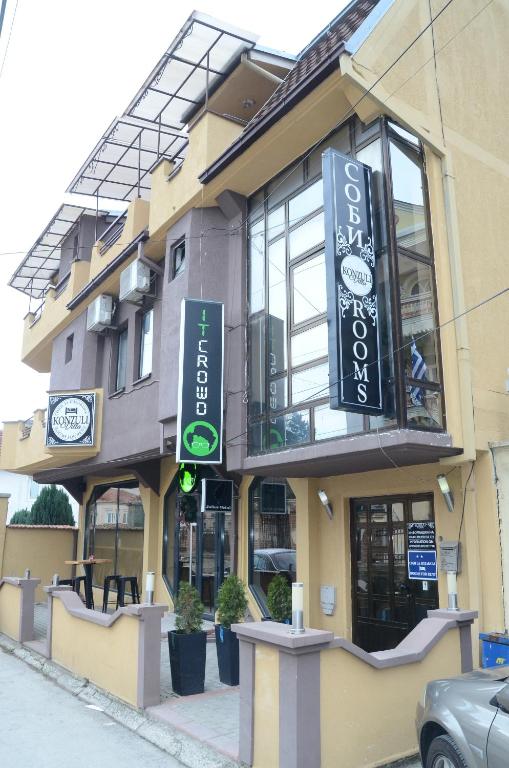 a building with signs on the side of it at Villa Konzuli in Bitola