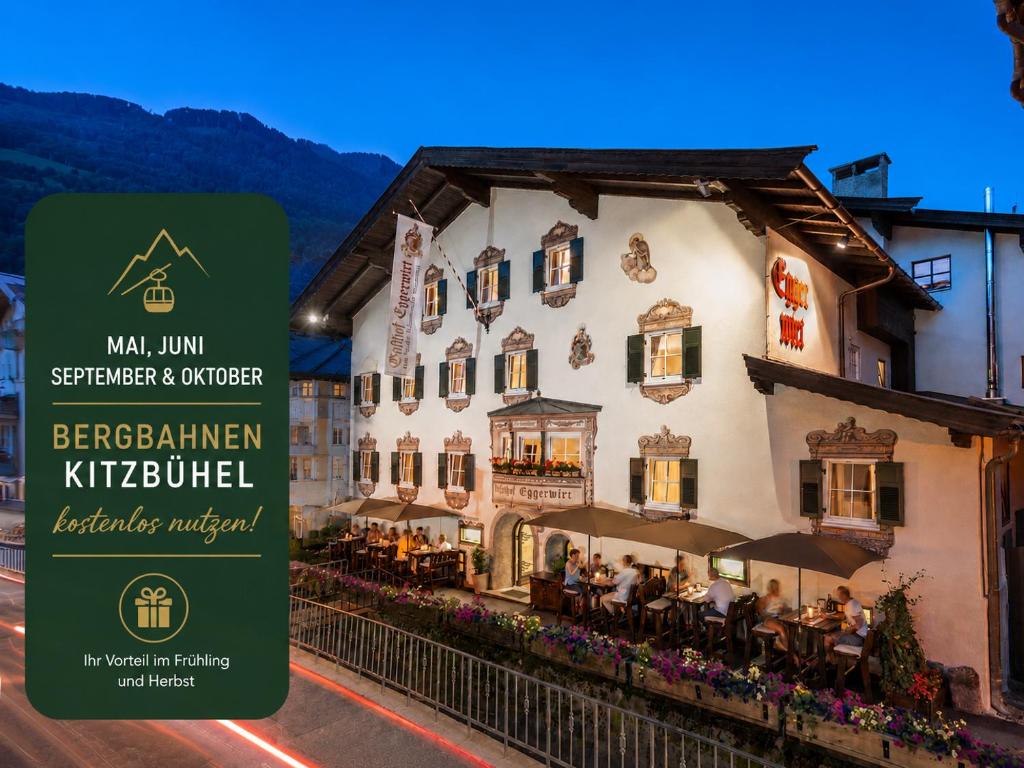 a building with a sign in front of it at Eggerwirt Kitzbühel, Hotel & Restaurant in Kitzbühel
