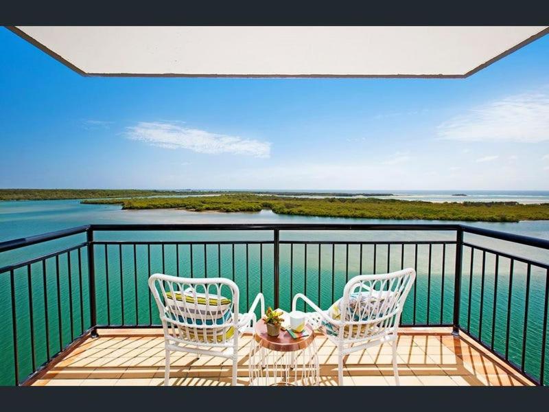 two chairs on a balcony with a view of the water at Banyandah Towers in Maroochydore