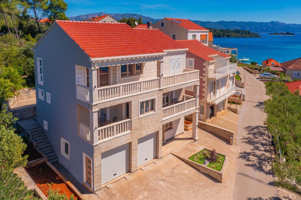 an overhead view of a house with a red roof at Milina Residence - Lumbarda in Lumbarda