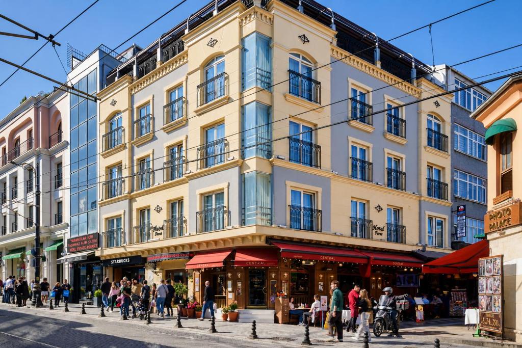 a building on a street with people walking in front of it at Faros Hotel Old City - Special Category in Istanbul