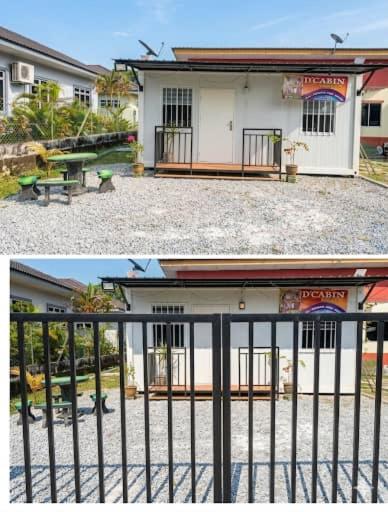 a building with a bench and a table in front of it at D'Cabin Roomstay in Sungkai