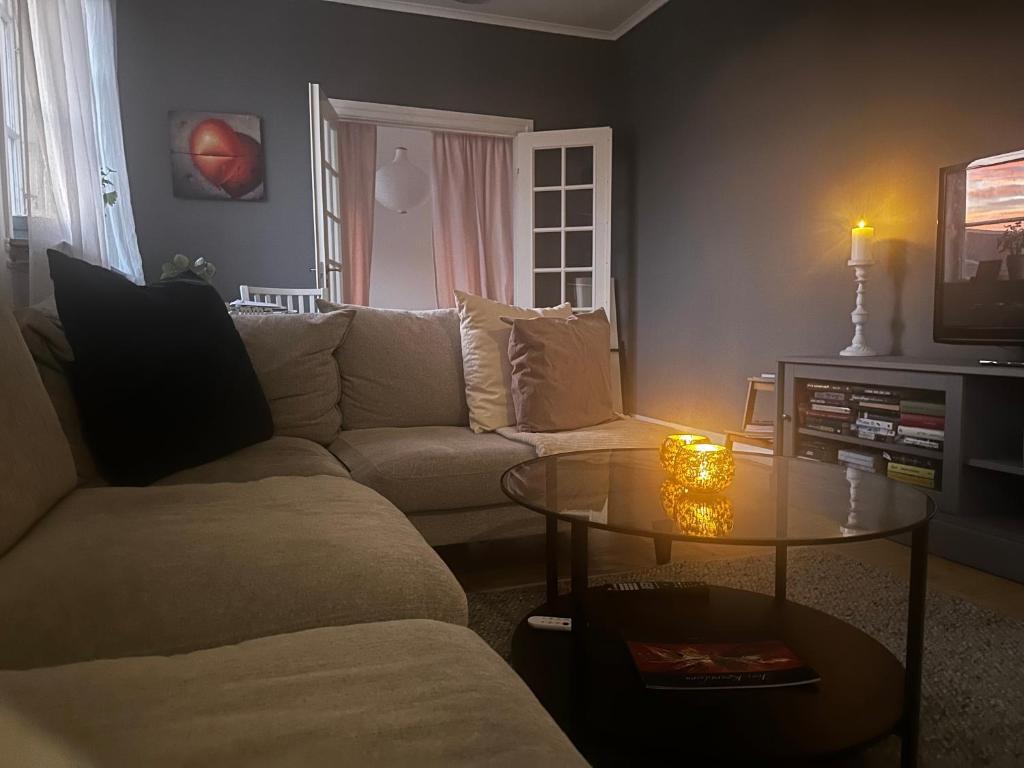 a living room with a couch and a table at Våning Margareta in Kalmar