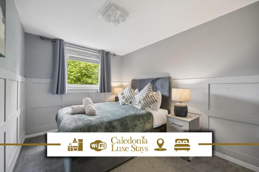 a small bedroom with a bed and a window at The Glasgow Nook in Glasgow