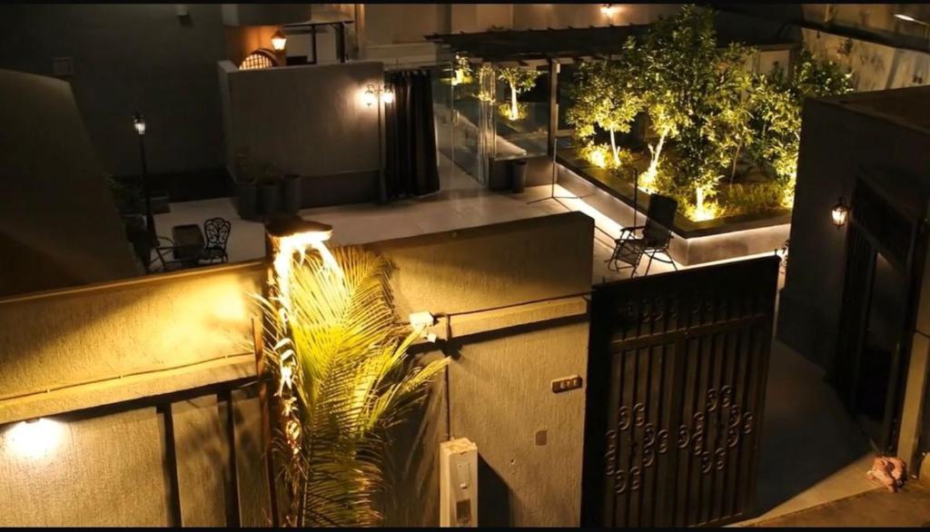 an overhead view of a balcony at night with a plant at استراحة ليال in Jeddah