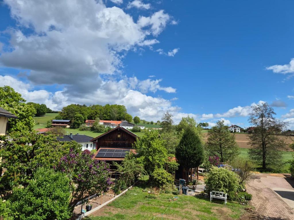 a view of a farm with a house and trees at Ferienwohnung Lechner in Treffelstein
