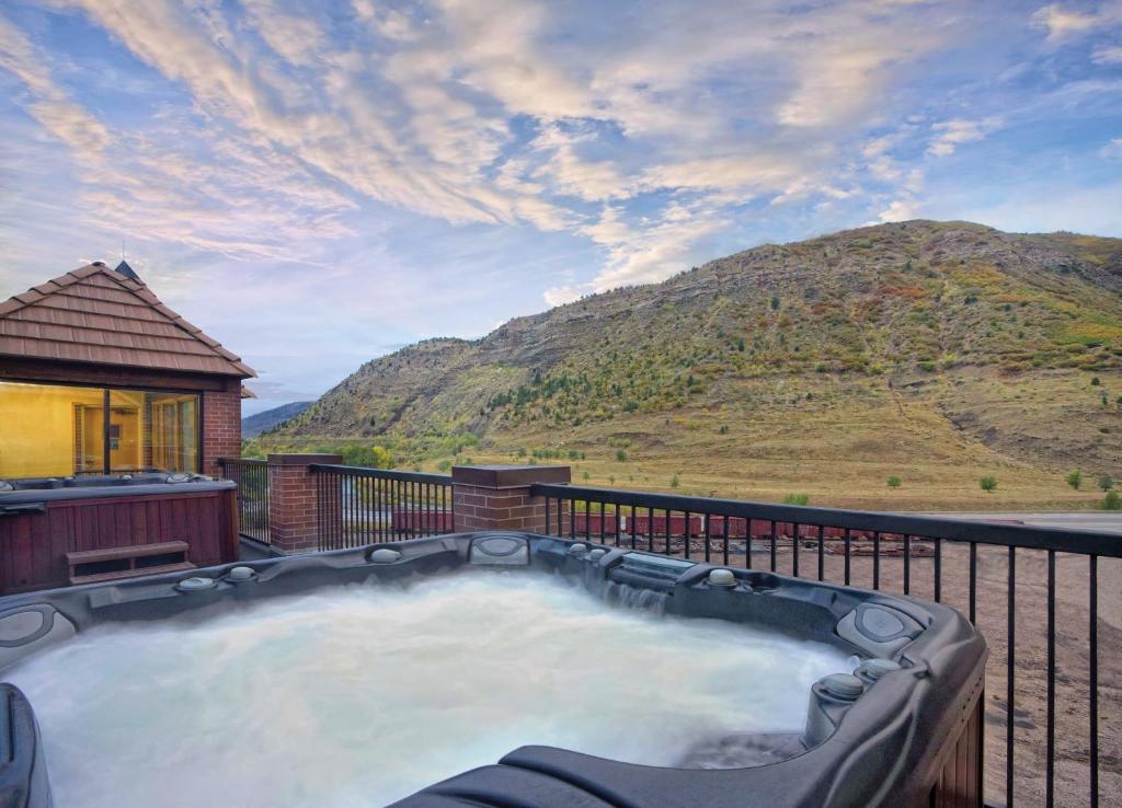a hot tub on a balcony with a mountain at Durango Resort 1BR Apartment in Durango