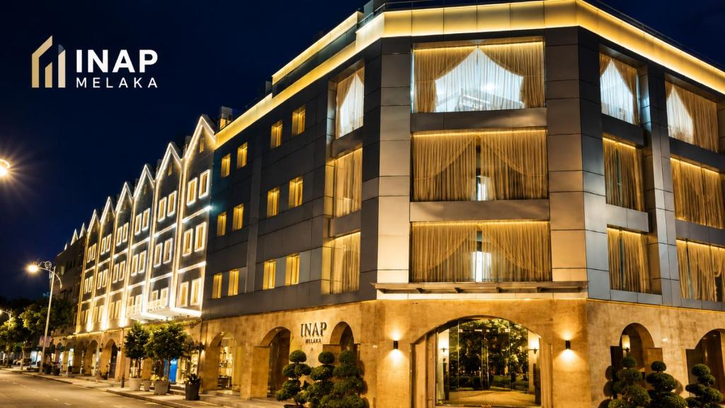 a building on a city street at night at INAP Melaka - Suites & Living in Malacca