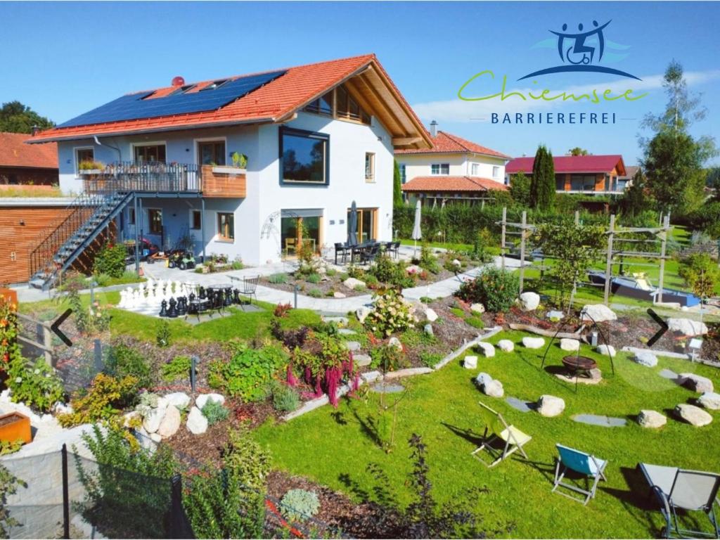 an aerial view of a house with a garden at Panorama Apartments by Chiemsee barrierefrei in Nußdorf