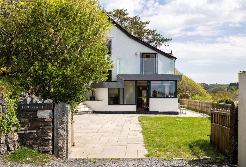 a house in the countryside with a driveway at Pentreath in Bude