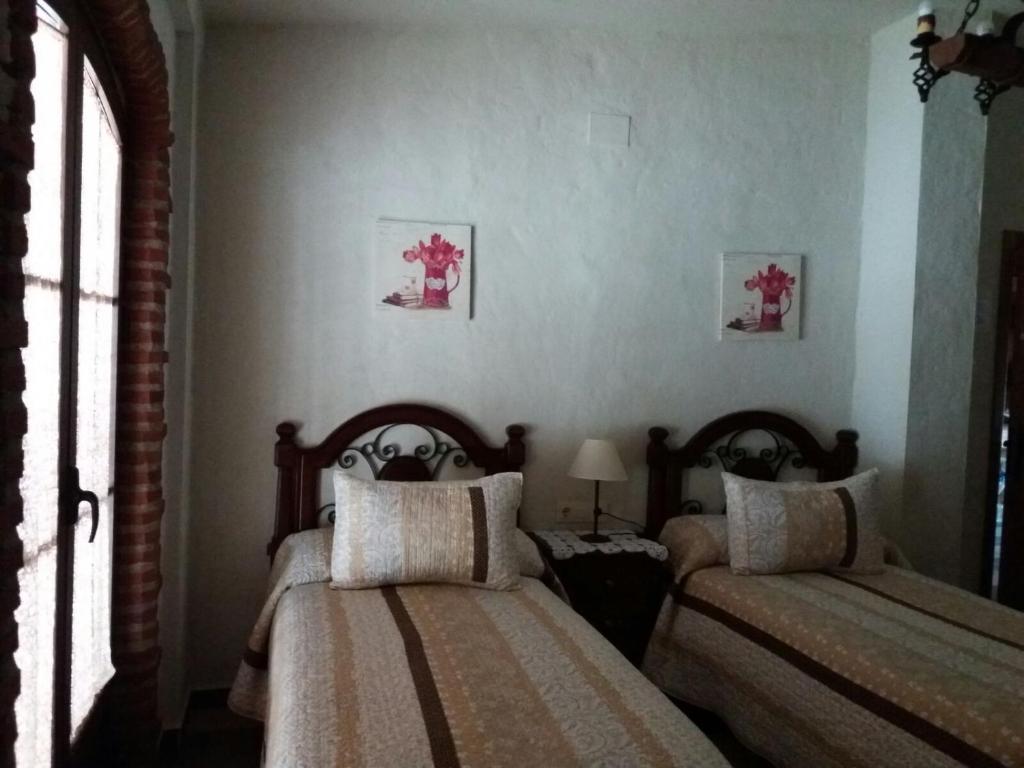 Postel nebo postele na pokoji v ubytování Virgen De Los Remedios