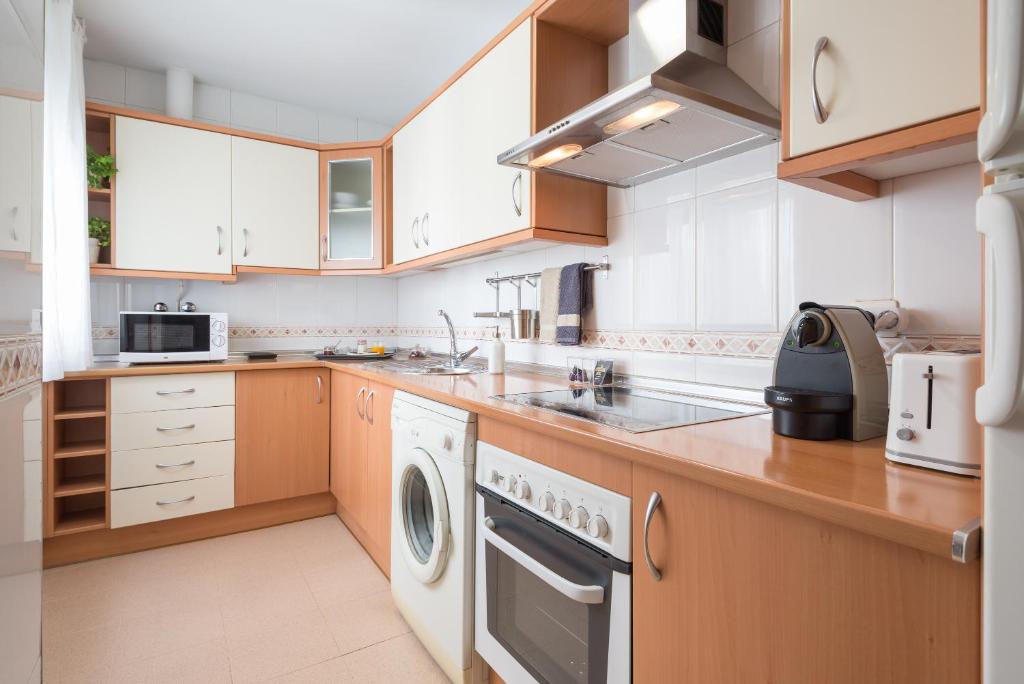 Kuchyň nebo kuchyňský kout v ubytování Colón12 Urban Apartment