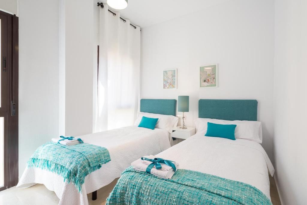 Postel nebo postele na pokoji v ubytování Colón12 Urban Apartment