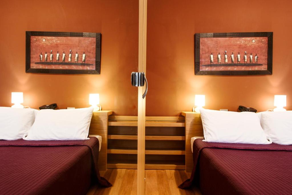 Postel nebo postele na pokoji v ubytování Hotel Del Viale