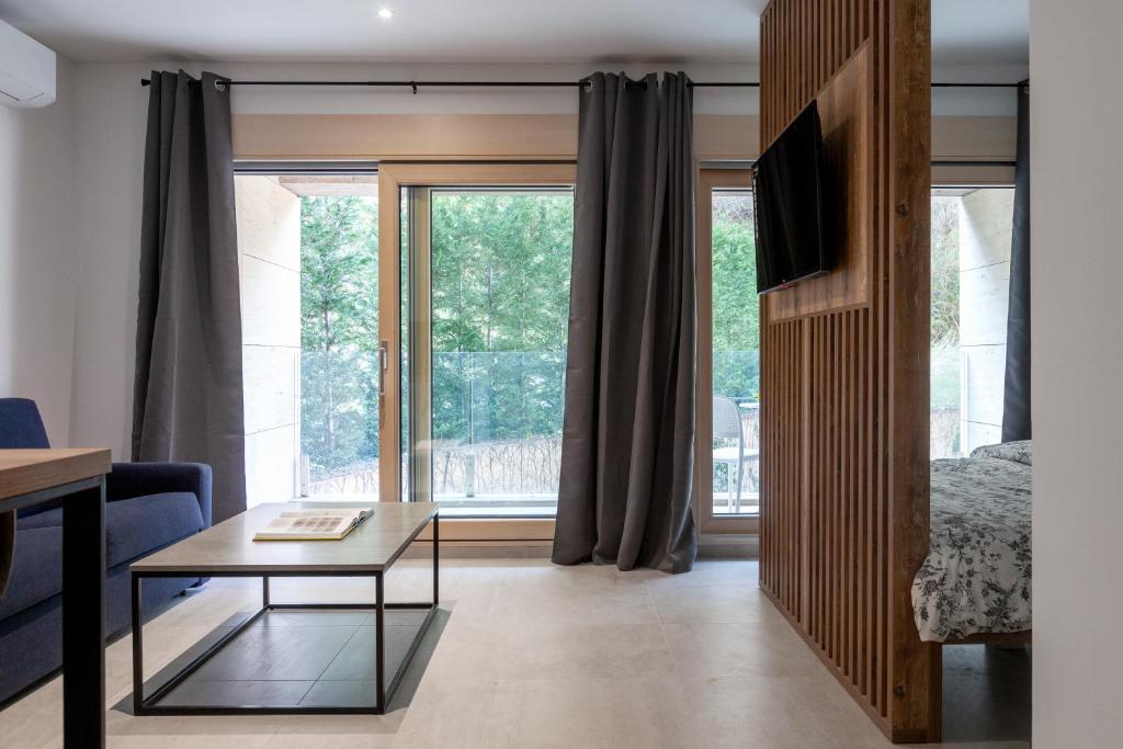 a living room with a coffee table and a window at Studio Rimini 523, Kotor in Kotor