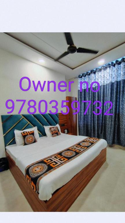 a bedroom with a bed with a sign on it at Aastha view inn in Amritsar