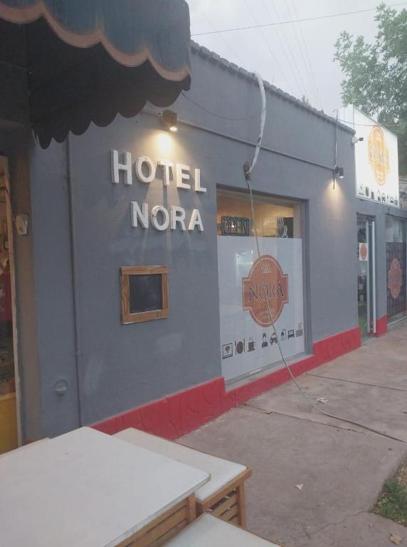 a hotel norema store with a sign on the side of it at Hotel Nora in Calingasta