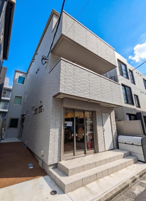 a building with steps in front of a building at Port House Honmachi in Tokyo