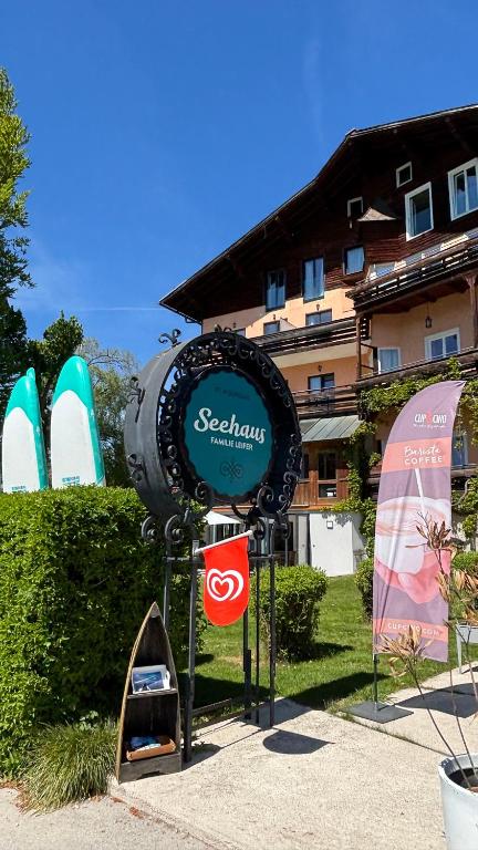 a sign for a resort with a surfboard on it at Seehaus Familie Leifer in St. Wolfgang