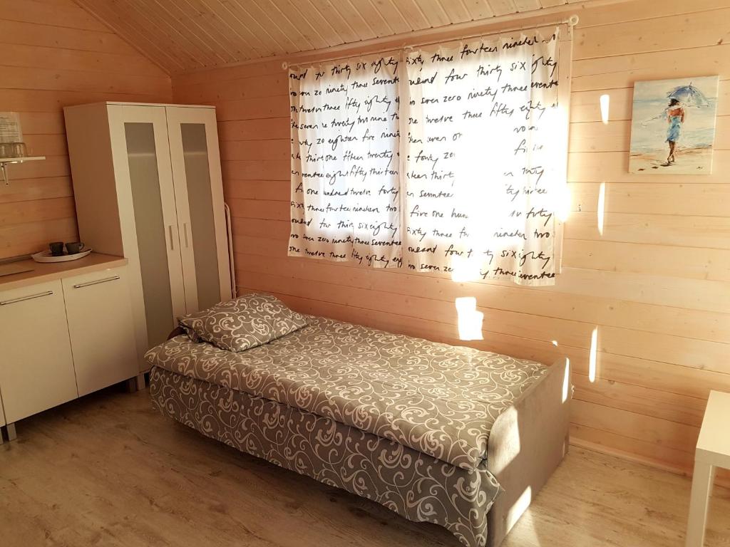 Postel nebo postele na pokoji v ubytování Komodor - OZONOWANE domki