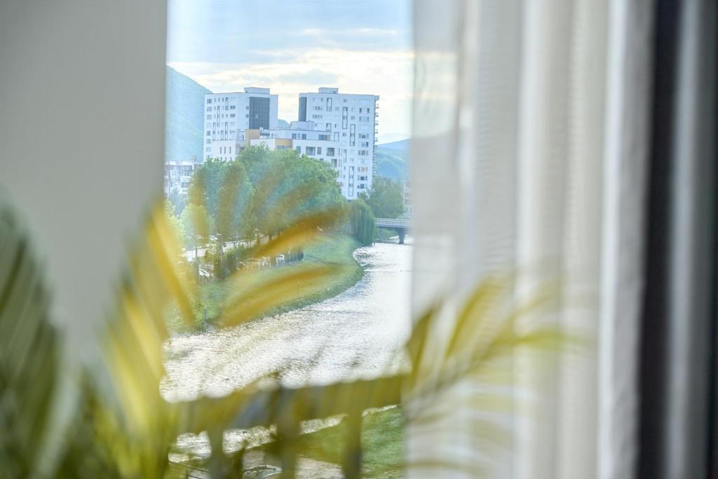 a view of a city from a window at Regency Aparthotel Sarajevo in Sarajevo