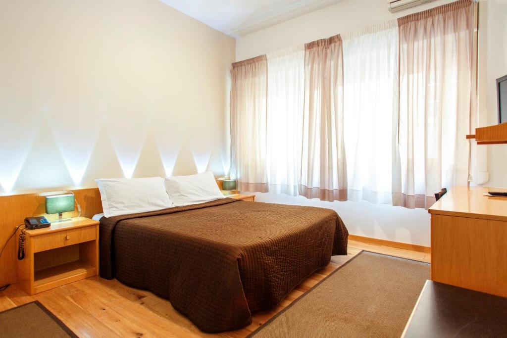 Postel nebo postele na pokoji v ubytování Hotel Del Viale