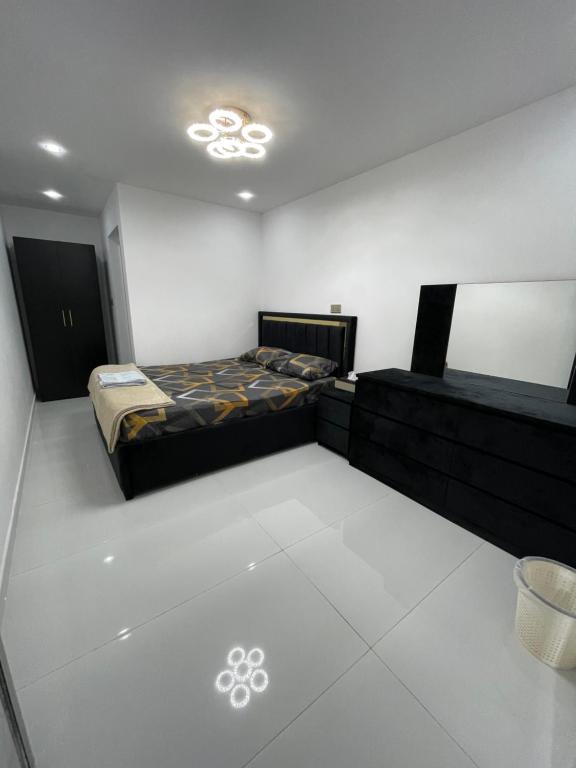 a bedroom with two beds in a room at Garden Villa 4, Ajman in Ajman 