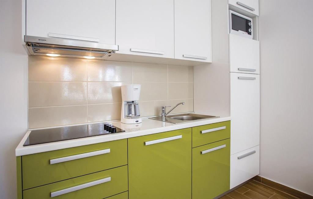 Kuchyňa alebo kuchynka v ubytovaní Apartman Prima