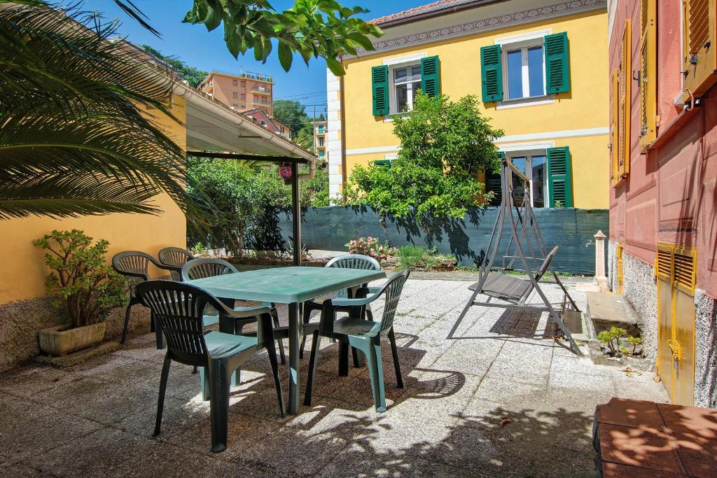 a patio with a table and chairs and a building at Casa Mia in Rapallo
