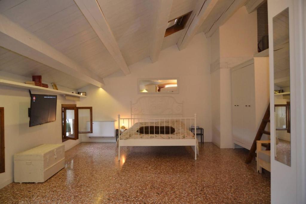 a large white room with a bed in it at La Spiga apartment near Venice in Noale