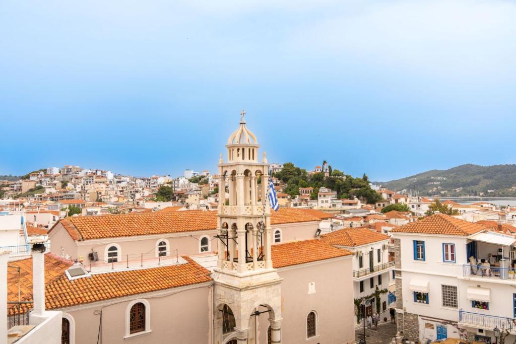 a view of a city with a clock tower at L anima II in Skiathos