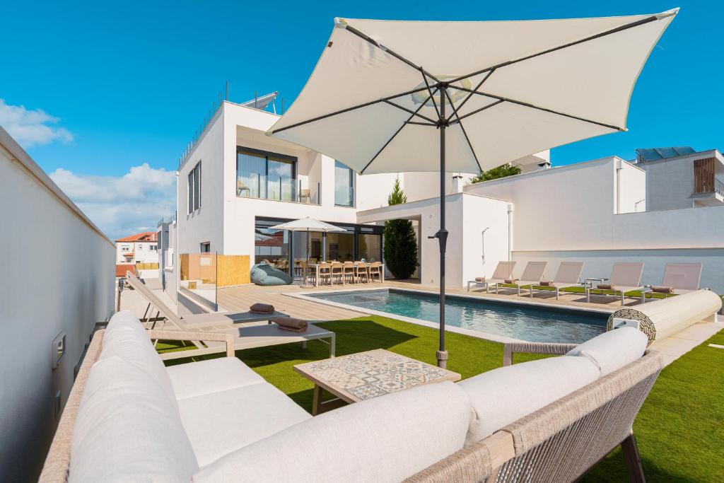 an image of a villa with a swimming pool at Paradise Villa Sea - Signature by Paradise Portugal in Ribamar