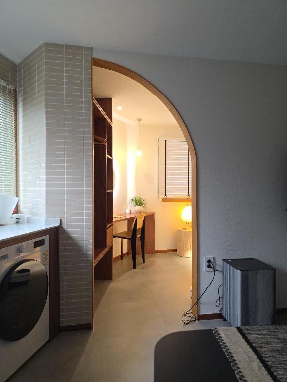 a bedroom with an archway leading to a dining room at Nakwon Stay 3-Min Walk to Anguk & Jongno 3-ga Stations in Seoul
