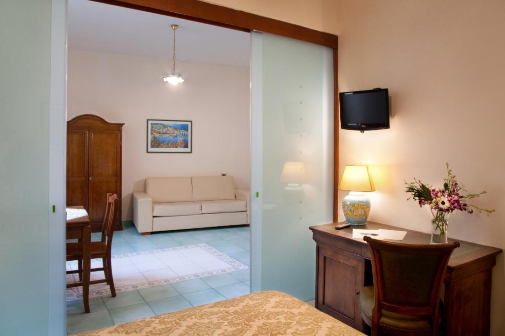 A bed or beds in a room at Albergo L'Antico Convitto