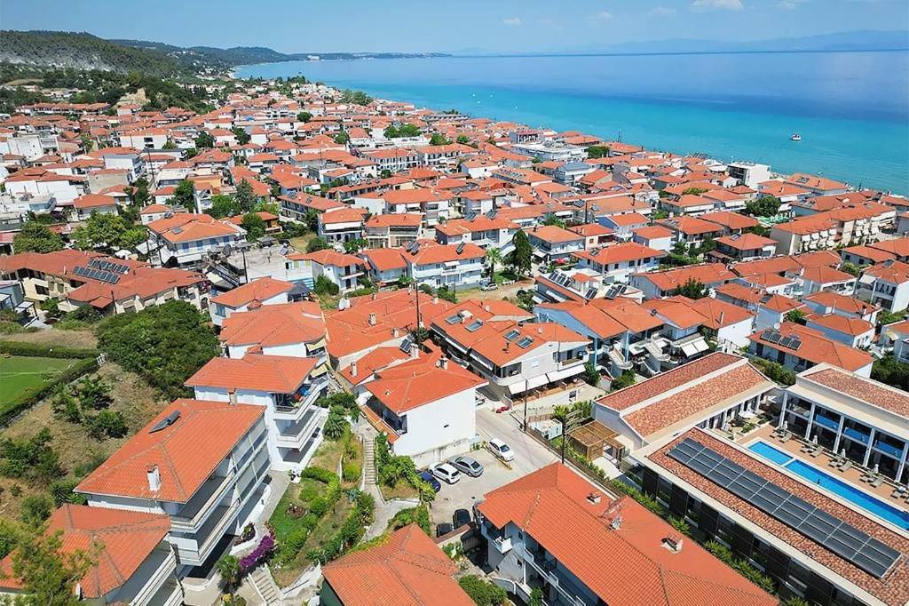 an aerial view of a town with orange roofs at Kai Guest House in Polychrono