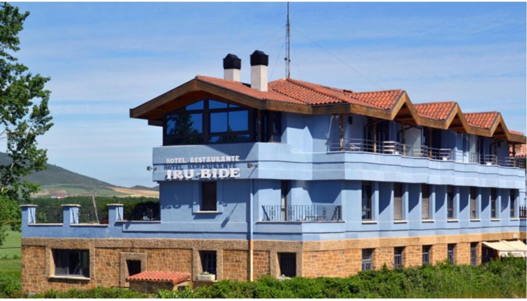 a building with a roof on top of it at RoomRural Hotel Iru-Bide Lumbier in Lumbier