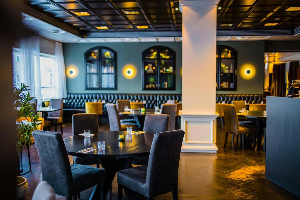 a dining room with tables and chairs at Hotel Kea by Keahotels in Akureyri