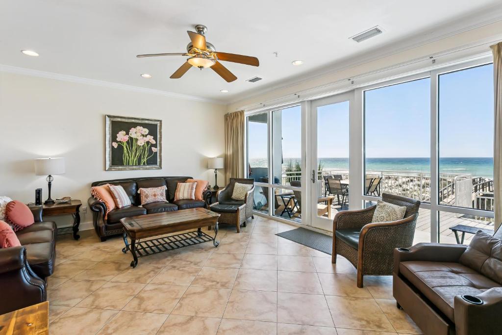 a living room with couches and chairs at 445 Fort Pickens Rd in Pensacola Beach