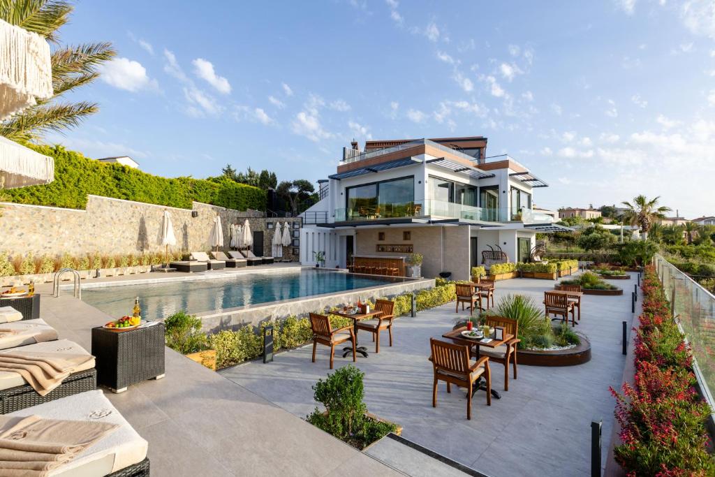 an image of a house with a swimming pool at Cesme Sarezya Luxury Boutique Hotel in Çeşme
