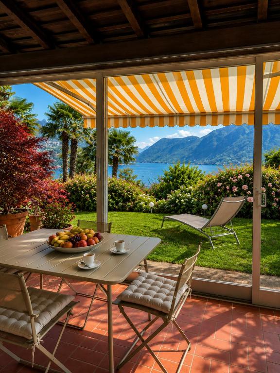 a table with a bowl of fruit on a patio at Lake View Palm Garden in Lugano