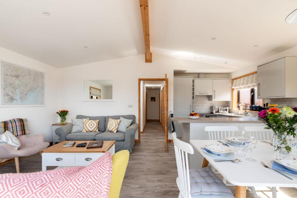 a living room with a couch and a table at L56 - Seaglass in Truro
