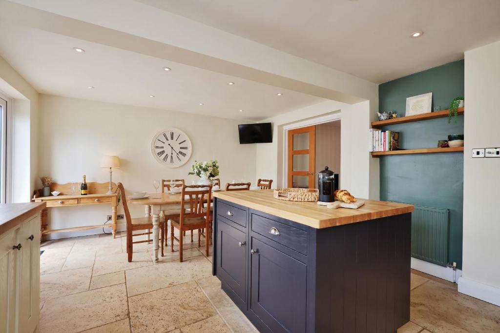 a kitchen with a table and a dining room at Spacious Free Parking 5 Mins from City Centre in Hereford