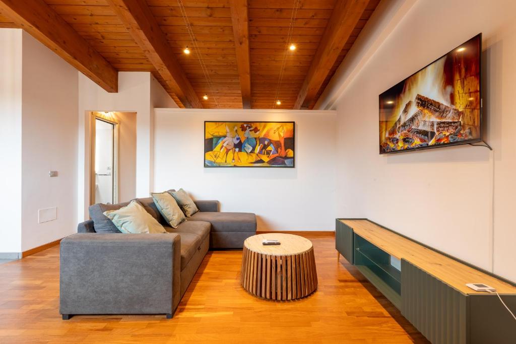 a living room with a couch and a table at AcquaRoom in Montesilvano Marina
